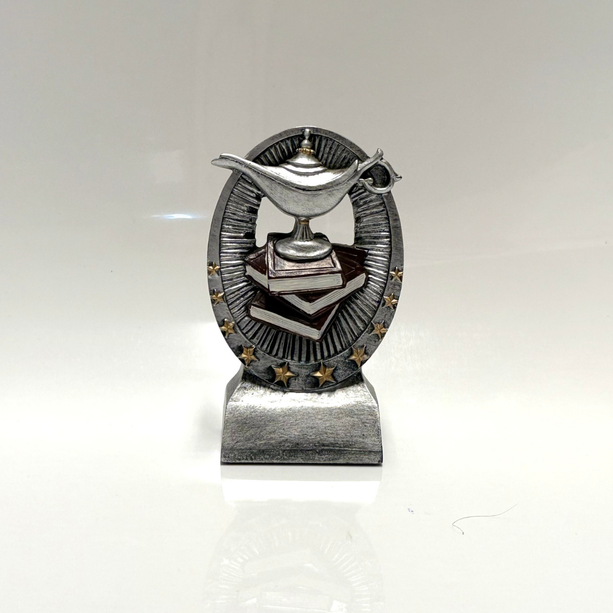 Trofeo Ovalado Lampara y Libro